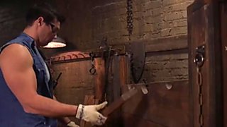 Brunette sub in pillory gets anal banged