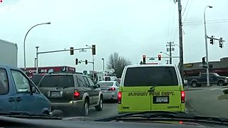 Insatiable brunette gives her boyfriend jerking job while he drives a car